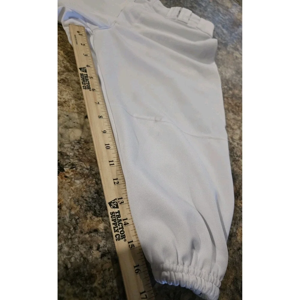 Under Armour branded inner waistband, tunnel belt loops, double snap closure. LG
